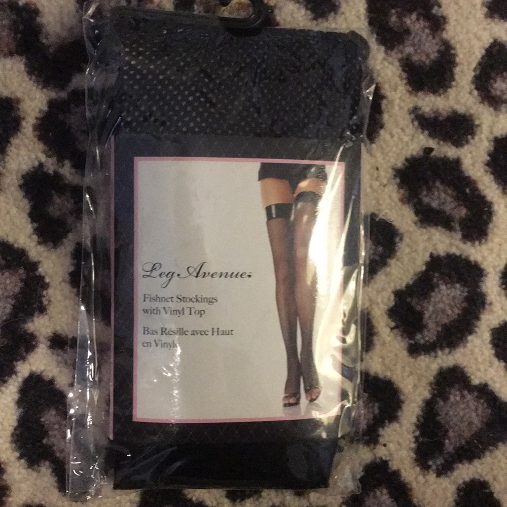 Fishnet thigh high stockings with vinyl top